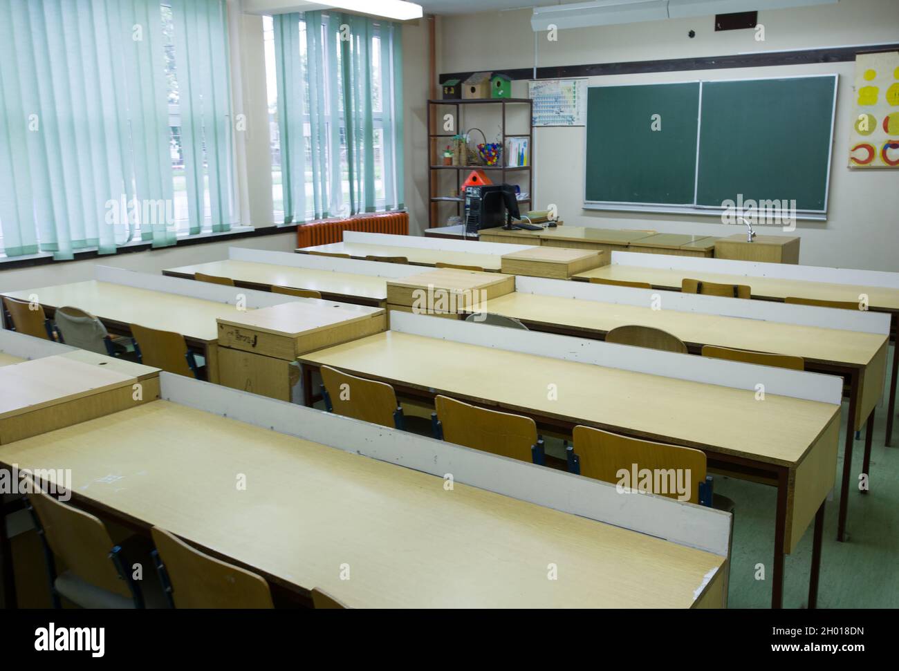 Empty classroom during covid-19 pandemic. Safety and recommended measures of social distancing and studying from home Stock Photo