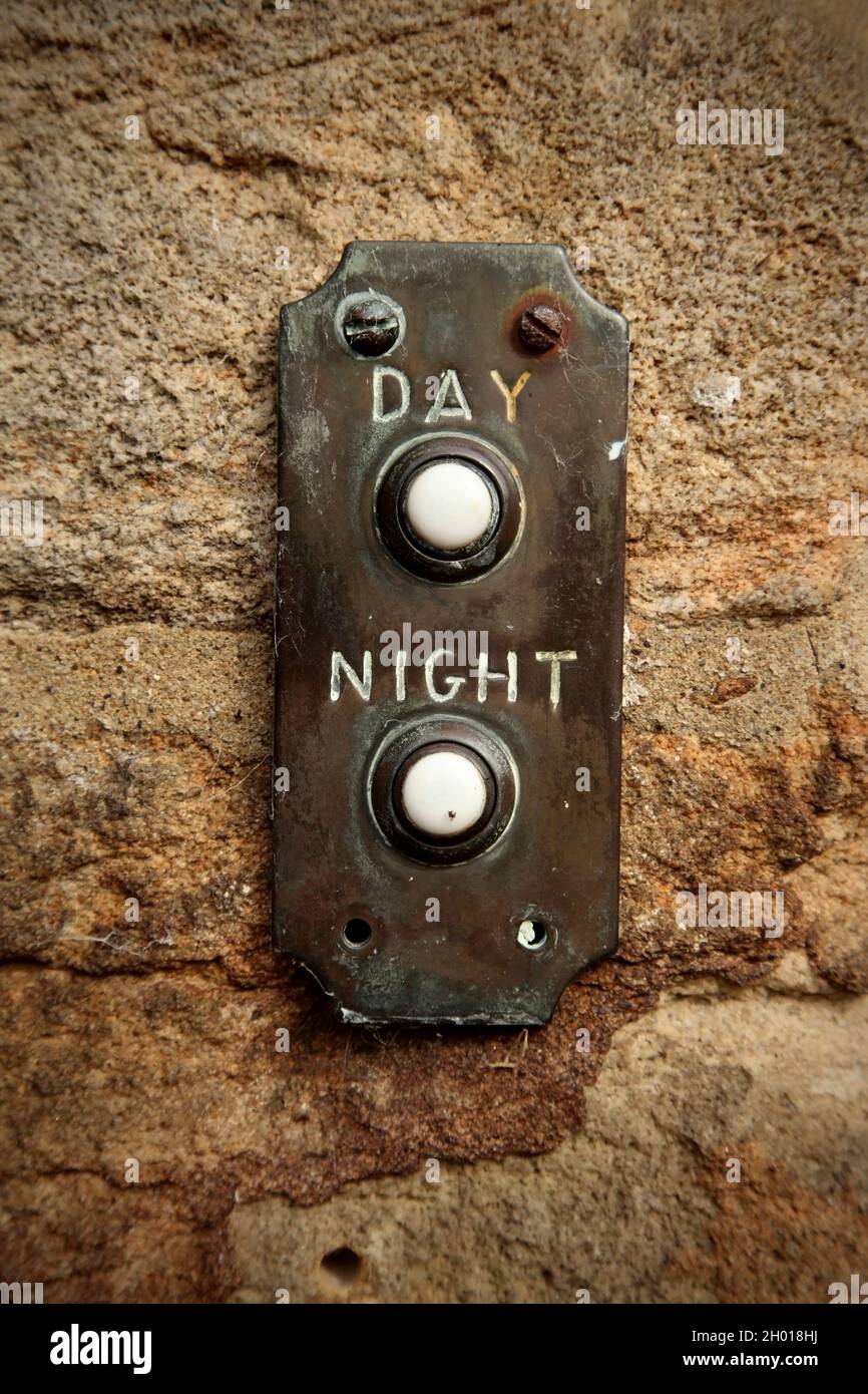 Day and night bells on old hotel Stock Photo Alamy