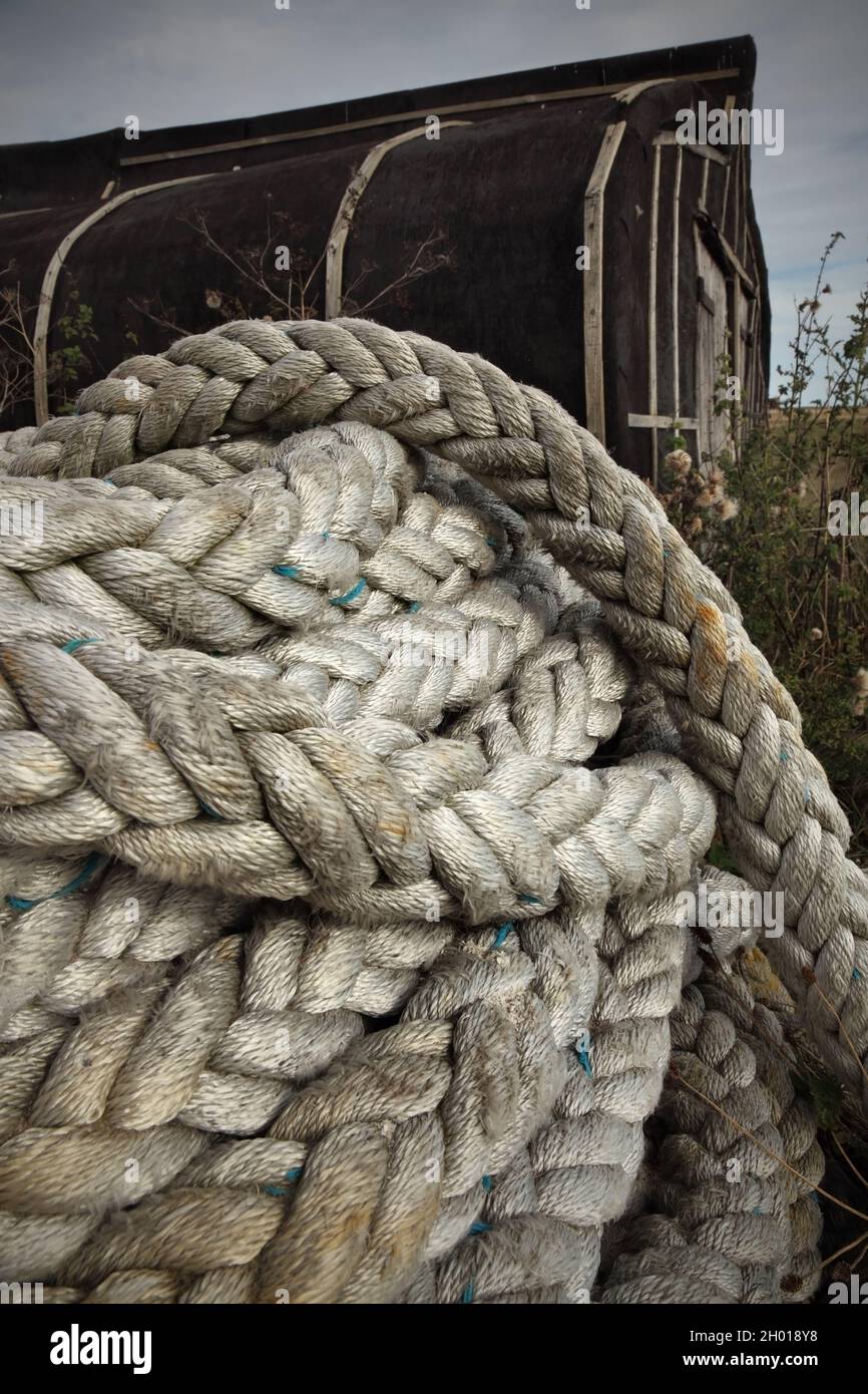 Fishermen's rope coiled in storage yard Stock Photo - Alamy