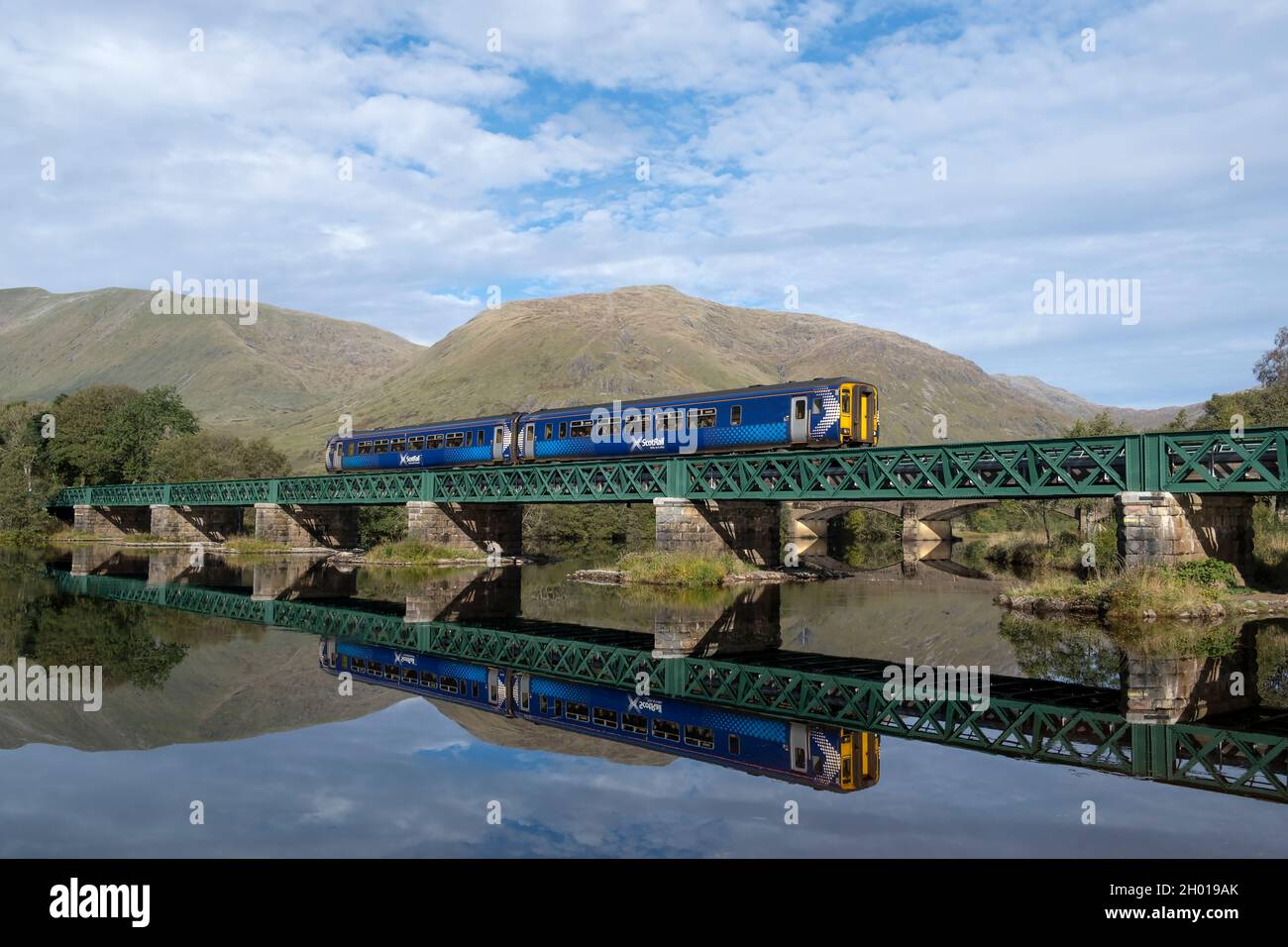 A Scotrail Class 156 DMU (156499) Is Seen Crossing Orchy Viaduct On The Oban Line. The Working Is The 12:11 Oban To Glasgow Queen Street Service. Stock Photo