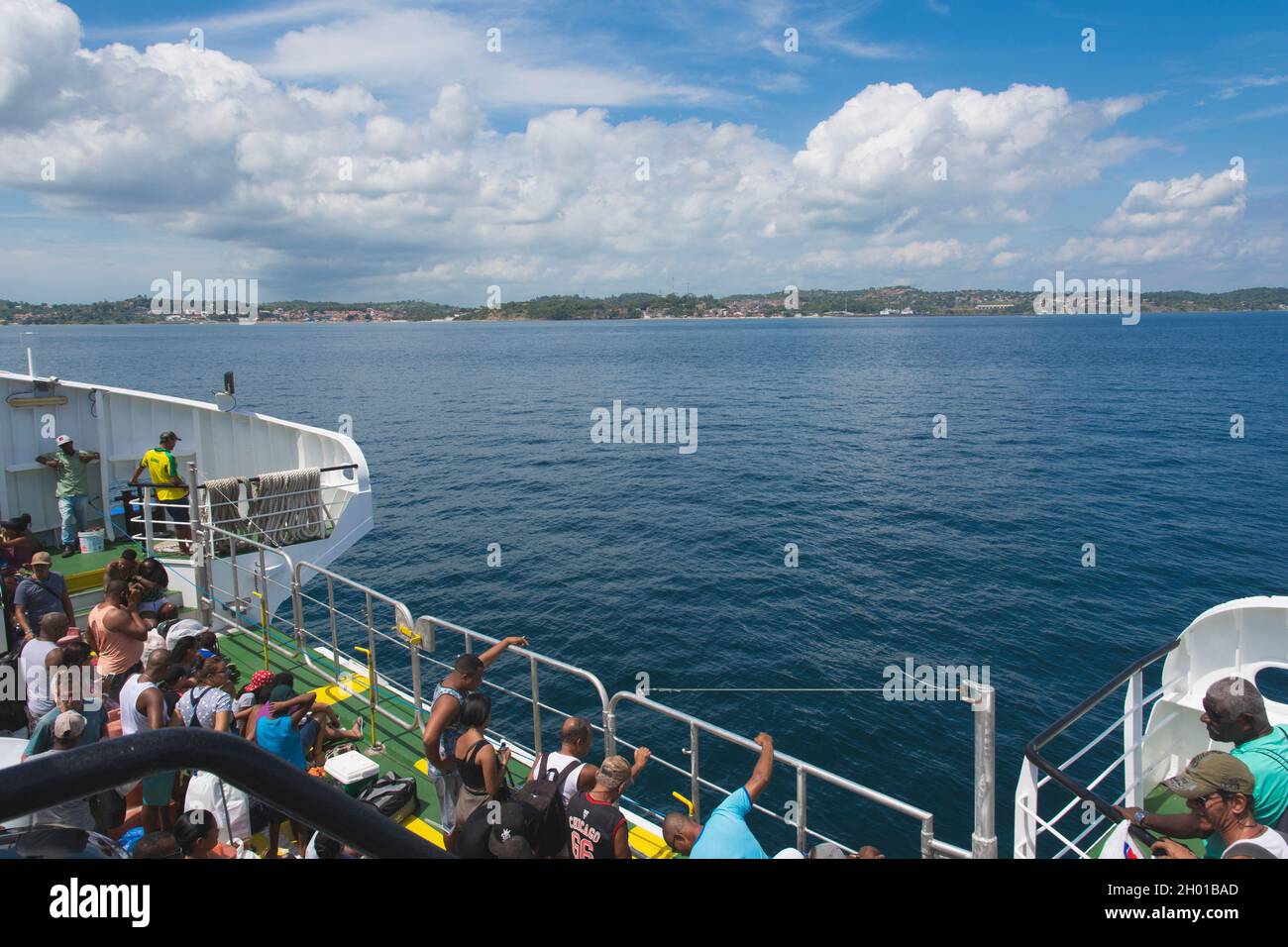 Salvador, Bahia, Brazil - December 30, 2018: Passengers on the ferry boat enjoying the view of the famous Itaparica Island in Salvador, Bahia. Stock Photo