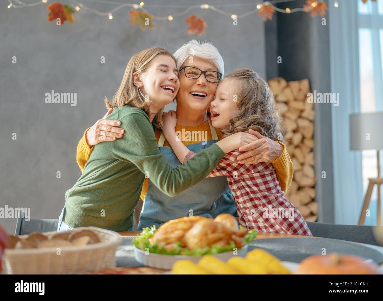 Thanksgiving Day, Autumn feast. Happy family sitting at the table and
