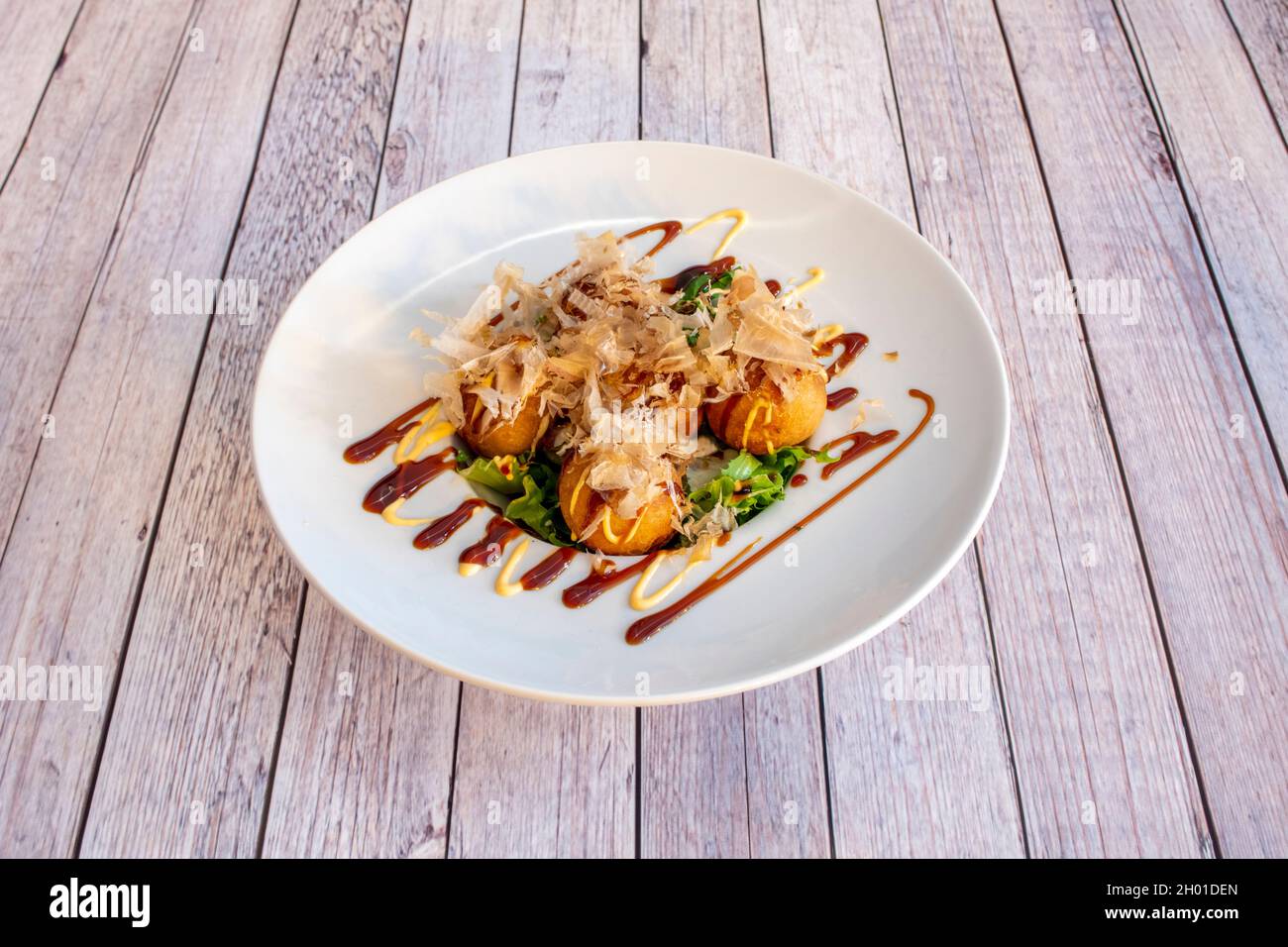 Japanese recipe for octopus takoyaki with soy sauce and dried tuna slices, Katsuobushi Stock
