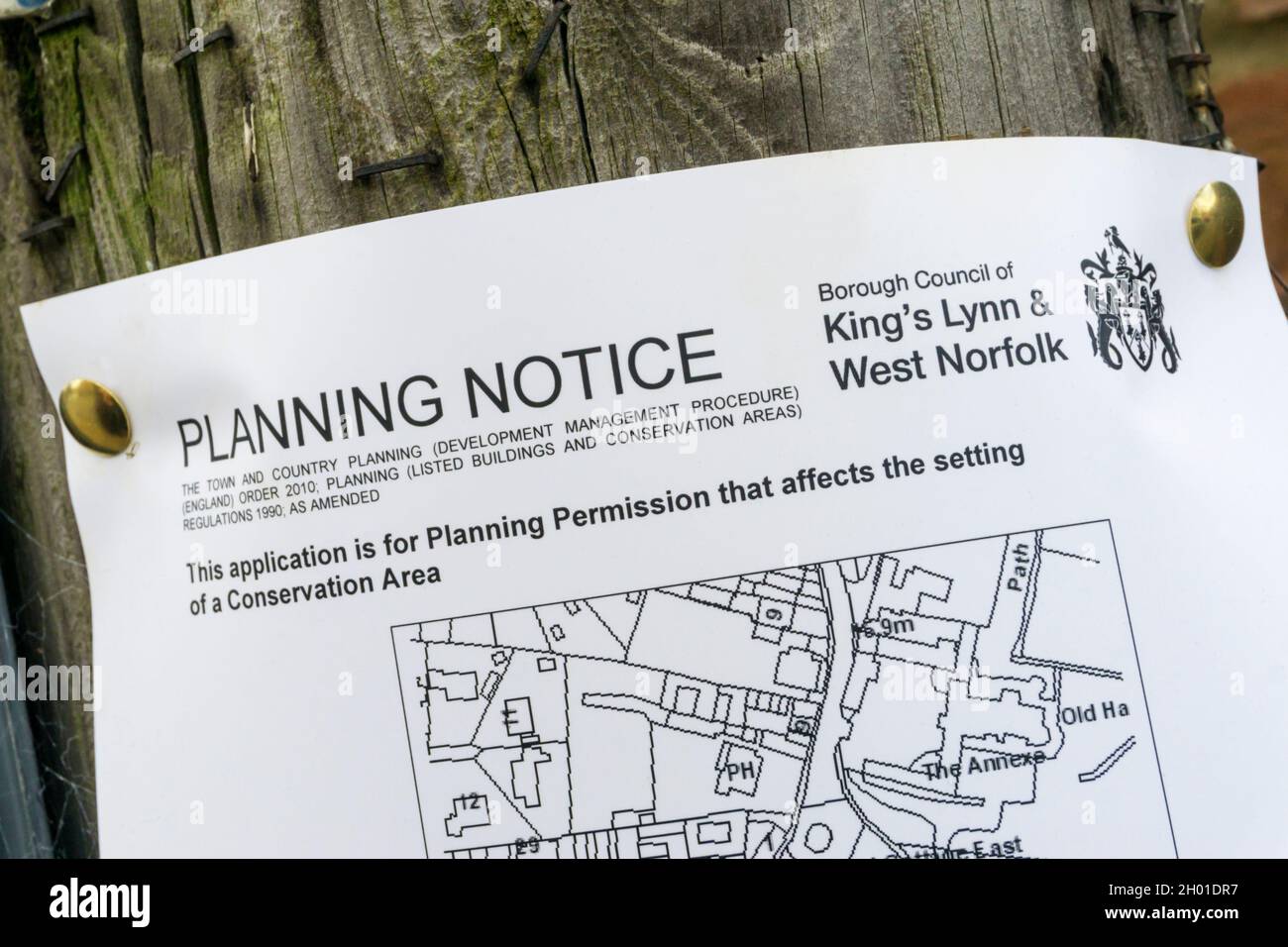 Planning Notice fixed to a building as part of application for planning permission affecting a Conservation Area. Stock Photo