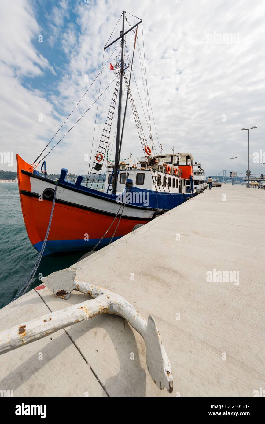 Fishing boat moored on the Turkish bank of the Bosphorus near Besiktas Stock Photo