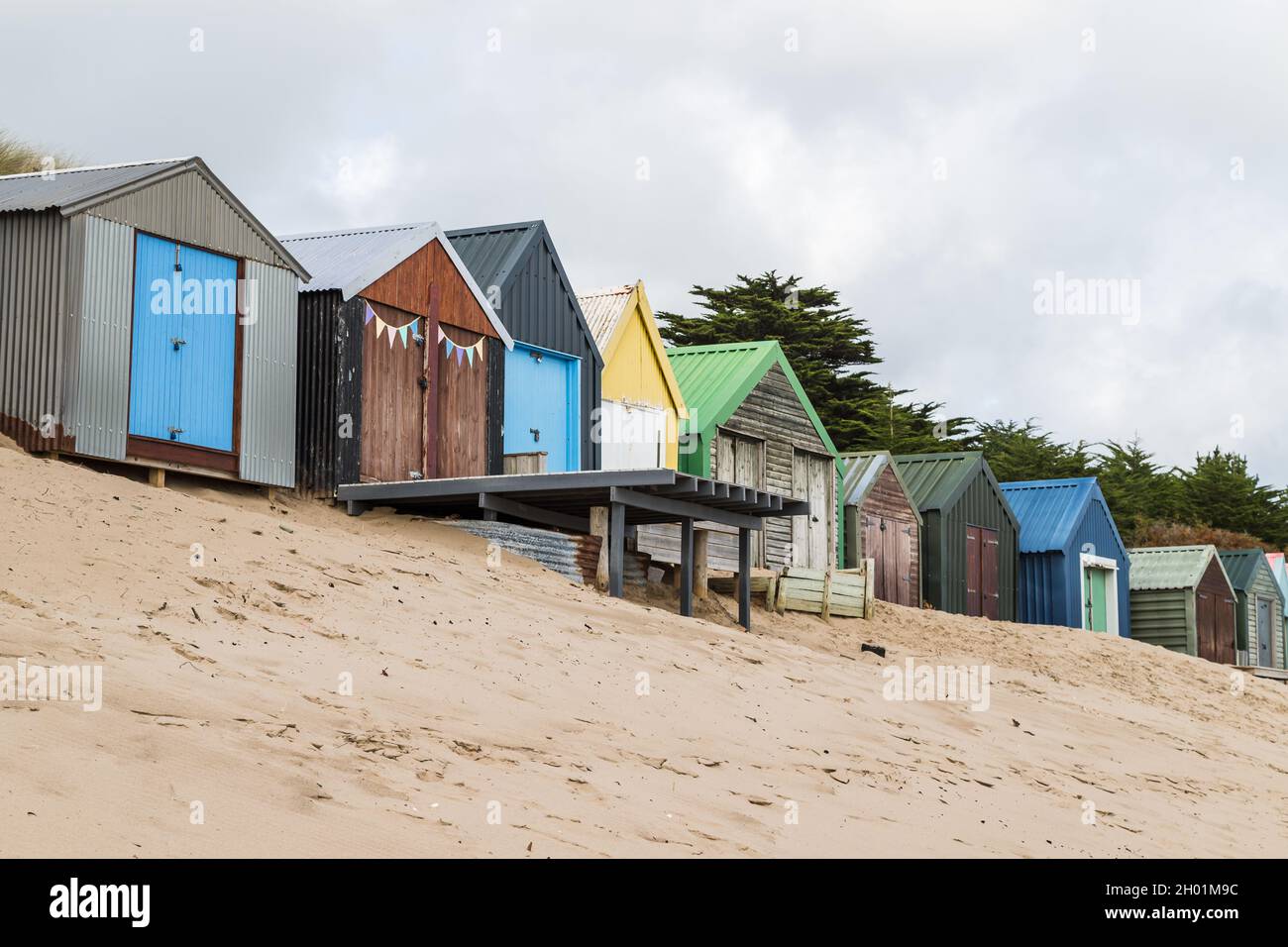 Beach huts in Abersoch Bay seen in North Wales during October 2021. Stock Photo