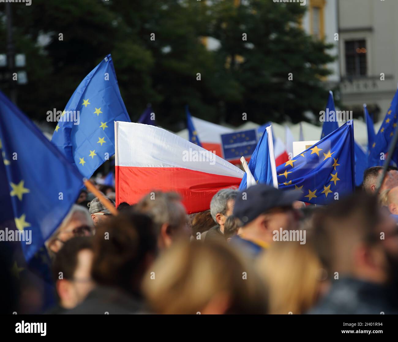 Crowd of people protest in Krakow street with flags of Poland and European Union to support Polands memebrship in EU structure Stock Photo