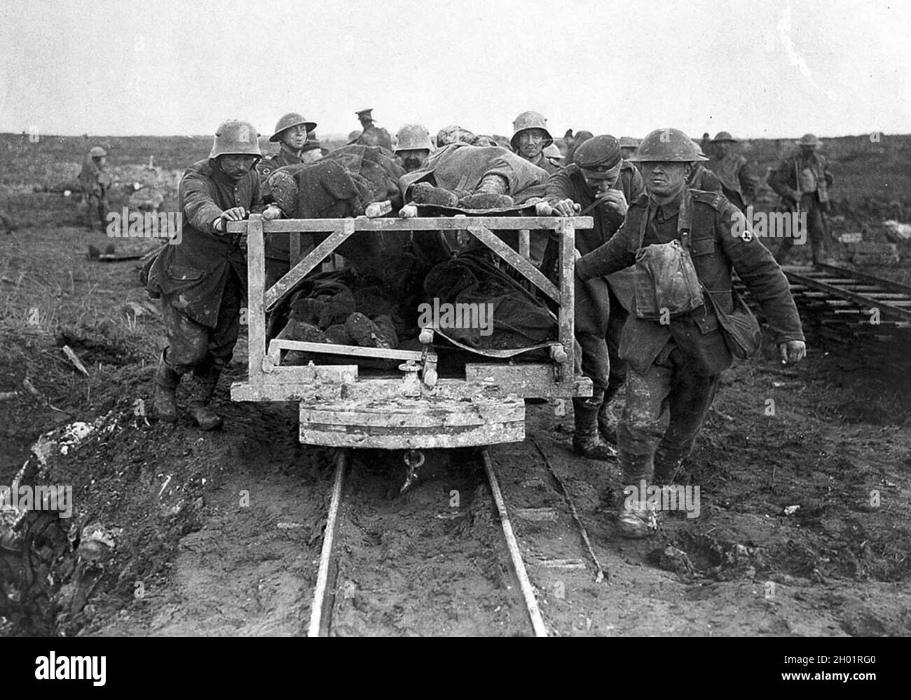 Bringing Canadian wounded to the Field Dressing Station, Vimy Ridge in April of 1917. German prisoners assist in pushing the rail car. Stock Photo