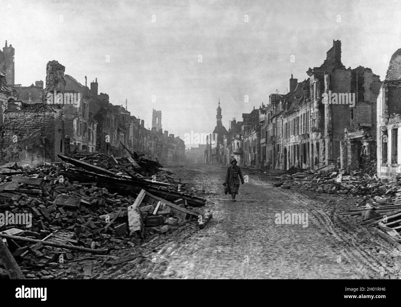 A German soldier walks through the ruined streets of Peronne. November, 1916. Stock Photo