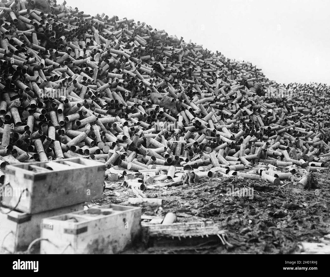 Mountains of shell cases by the road near the front lines. Millions of shells were fired during the mass bombardments before a major assault on the enemy trenches. Stock Photo