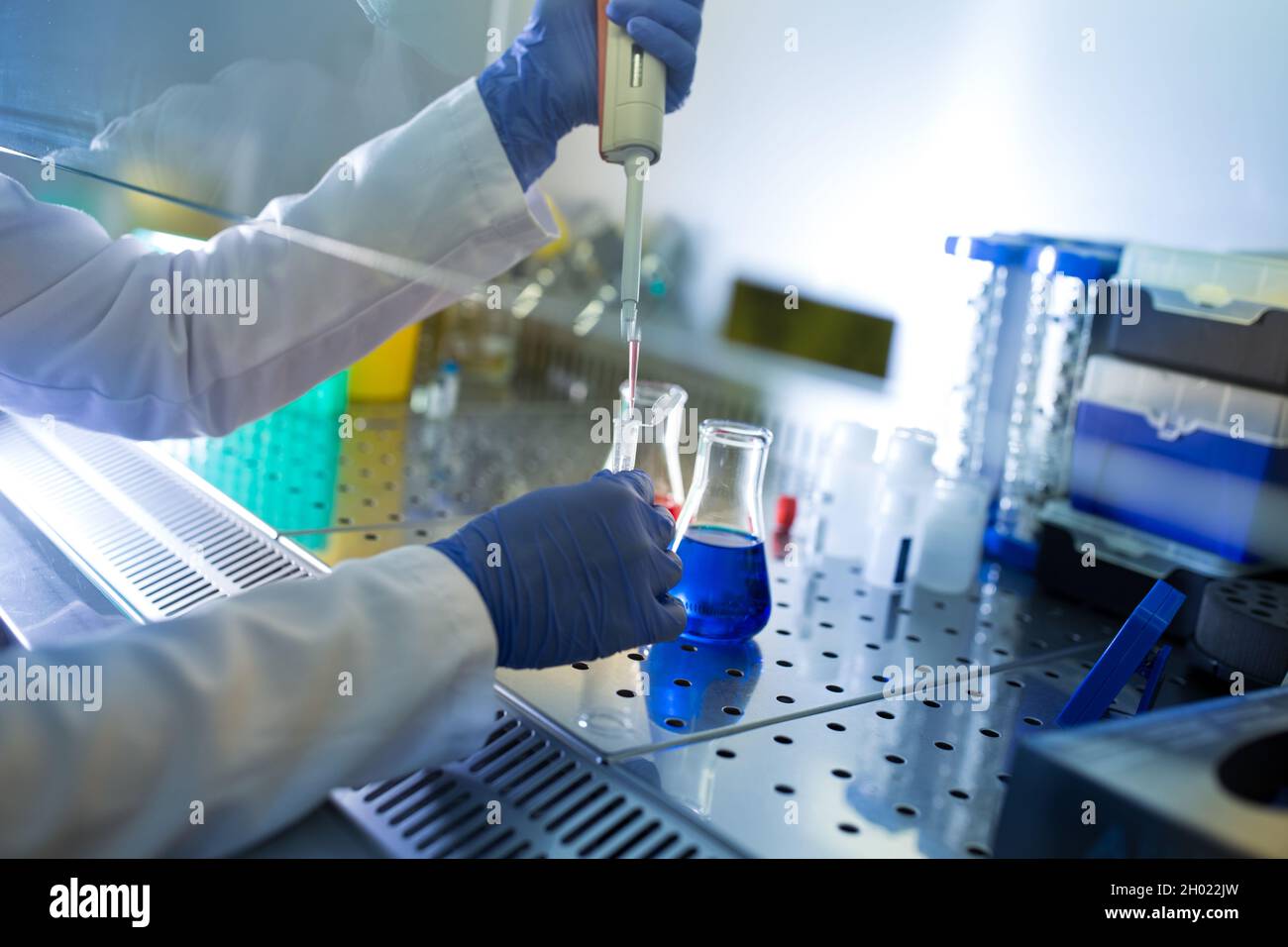 Biologist working in uv glow box in laboratory with chemicals Stock ...