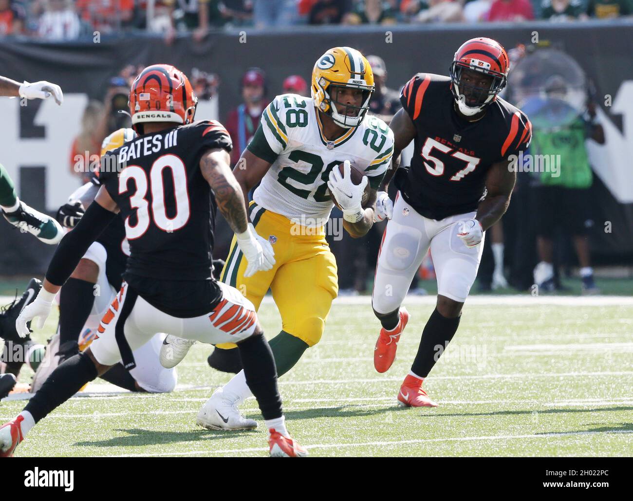 Cincinnati, United States. 10th Oct, 2021. Green Bay Packers running back AJ Dillion (28) breaks free from Cincinnati Bengals Jessie Bates (30) during the first half of play at Paul Brown Stadium in Cincinnati, Ohio, Sunday, October 10, 2021. Photo by John Sommers II /UPI Credit: UPI/Alamy Live News Stock Photo