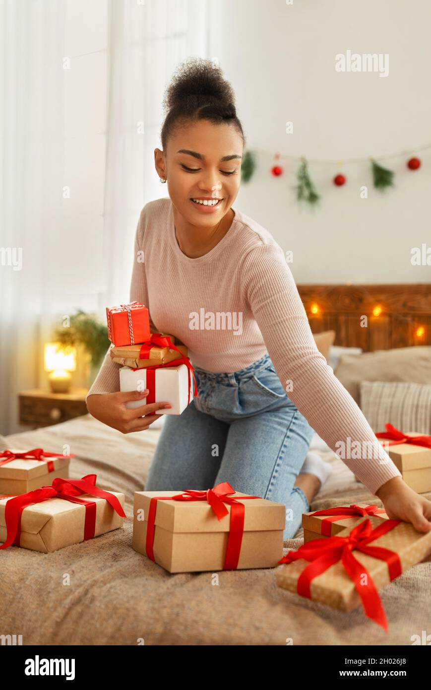 Young woman surrounded presents hi res stock photography and