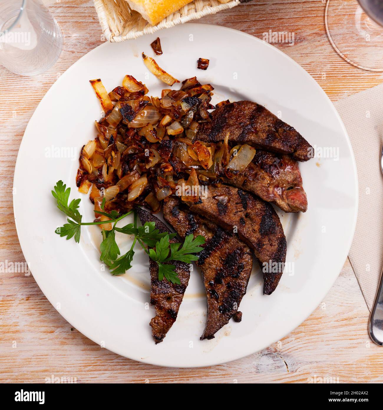 Tasty cooked fried liver pork with fried onion Stock Photo - Alamy
