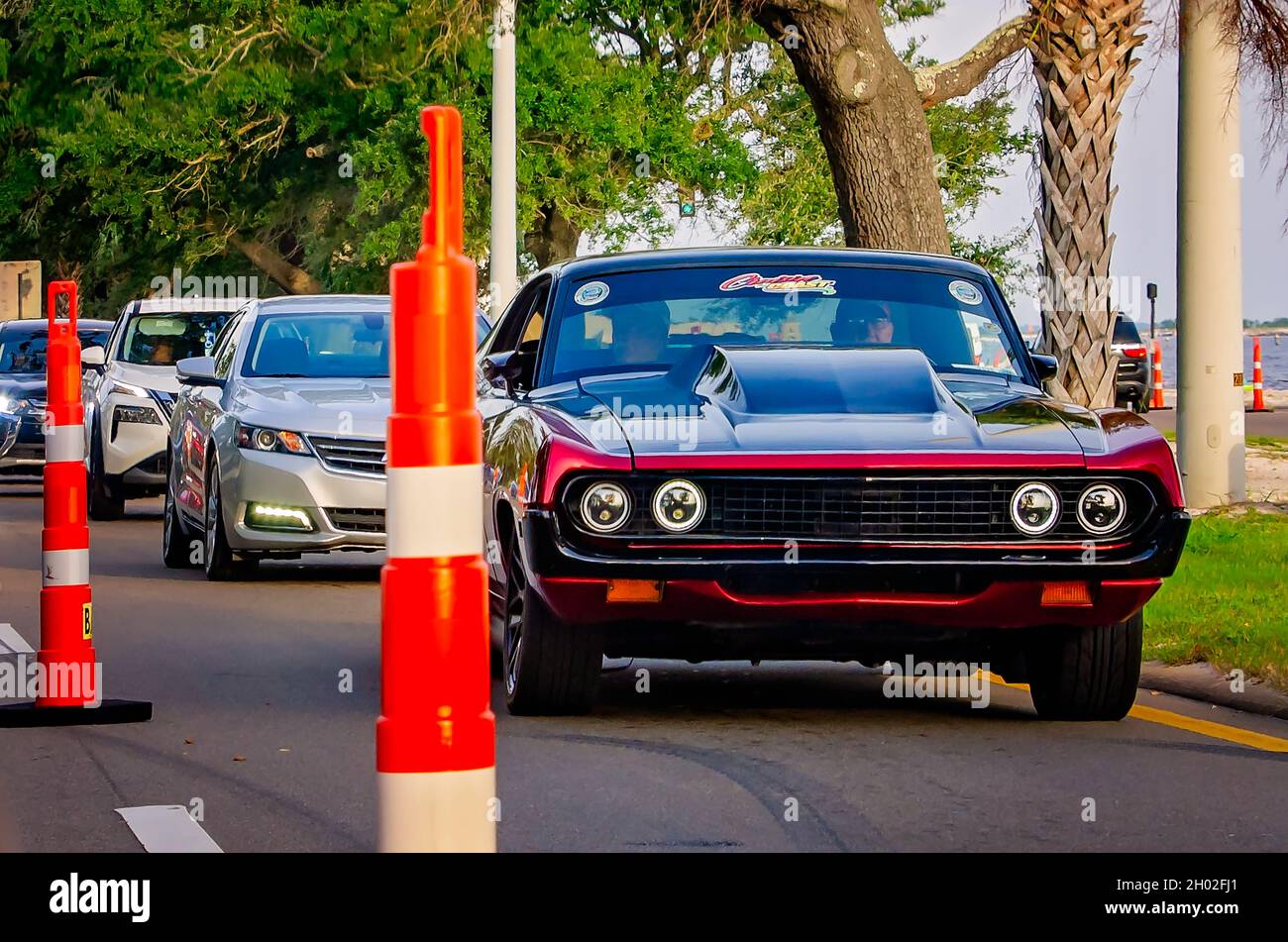 A classic car drives down Highway 90 during the 25th annual Cruisin