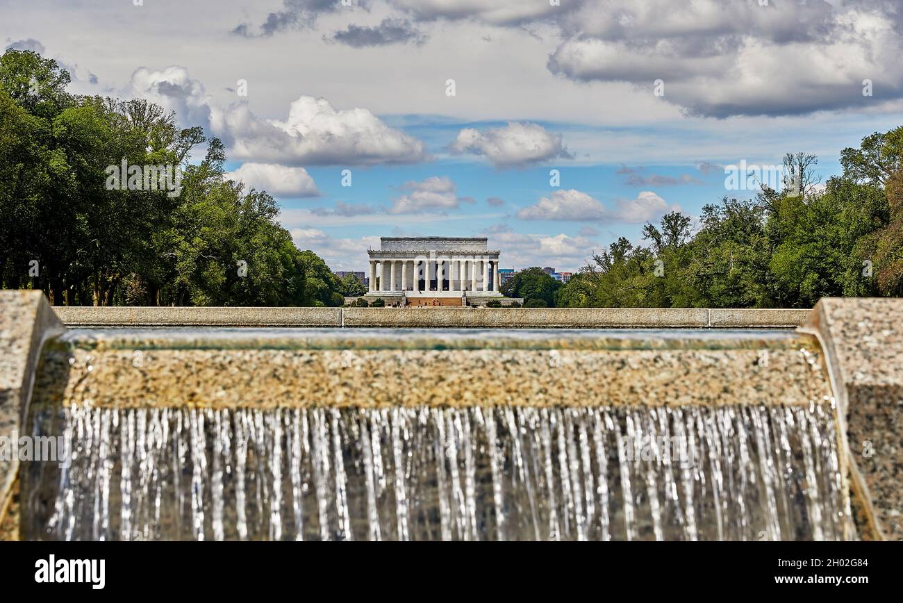 Washington DC, USA-August 19, 2021: World War II Memorial water fall in the foreground with the Lincoln Memorial in the background Stock Photo