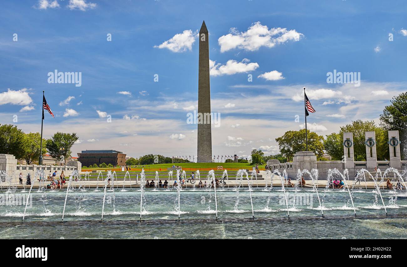 Washington DC, USA-August 19, 2021: World War II Memorial water fountain and tourists with the Washington Monument in the background Stock Photo