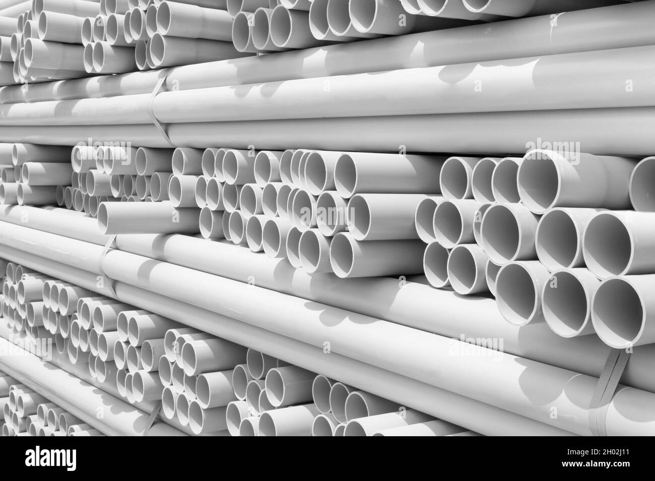 White PVC pipes stacked in construction site Stock Photo Alamy