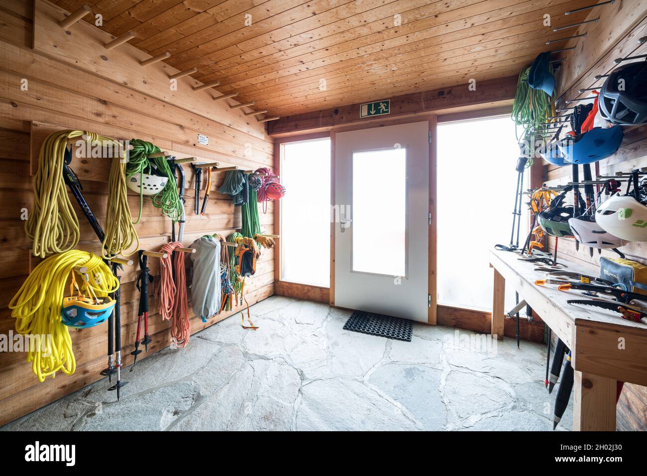 The mountain climbing gear room at Mischabelhütte Alpine hut near SaasFee, Switzerland Stock