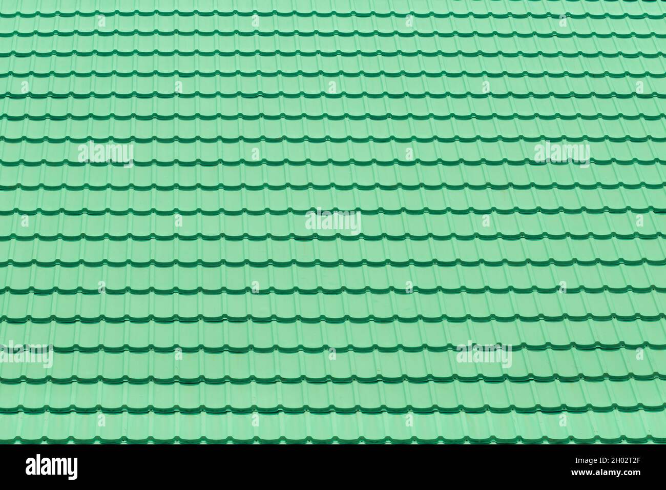 Texture and pattern of green roof tiles use for background Stock Photo