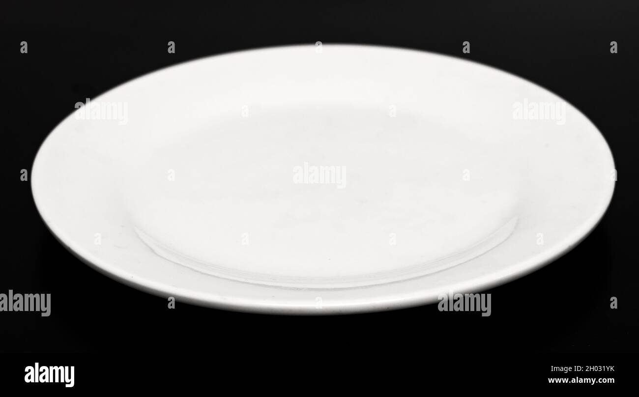 Plate on a black background Stock Photo