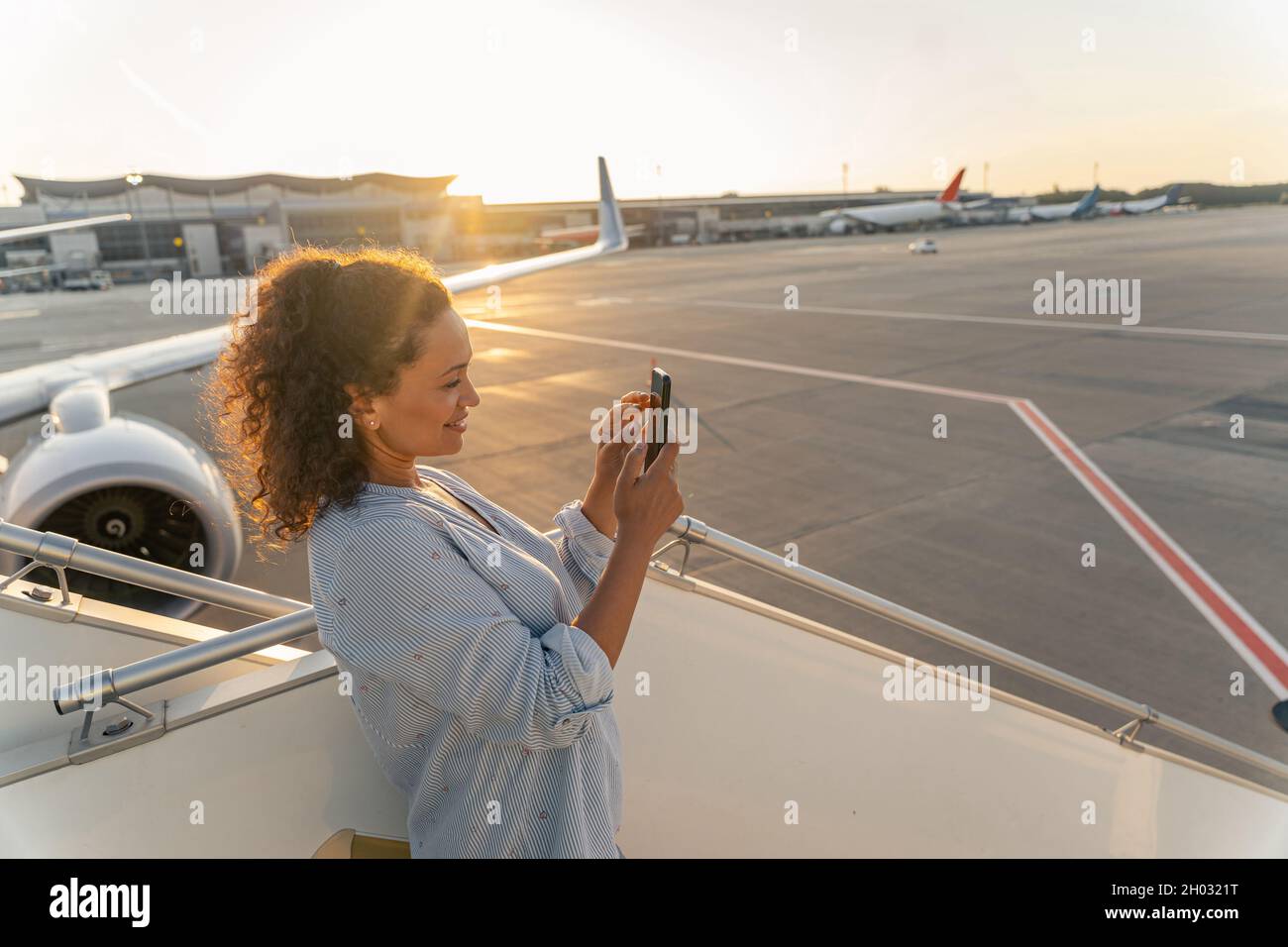 Young beautiful woman in airport hi-res stock photography and images ...