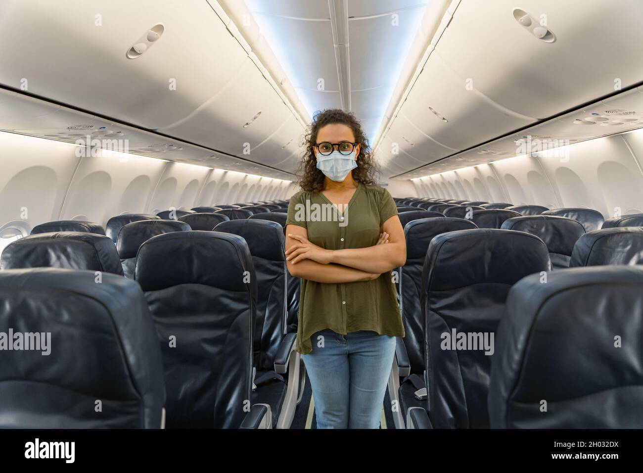 female traveller wearing mask during trip by plane Stock Photo Alamy