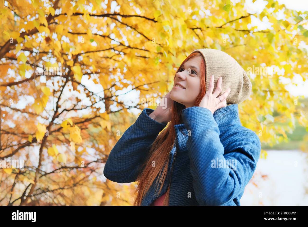 Real woman in yellow coat hi-res stock photography and images - Alamy