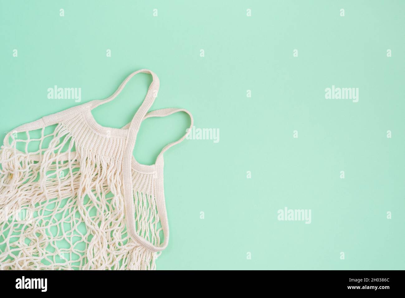 Eco bag on turquoise paper background Stock Photo