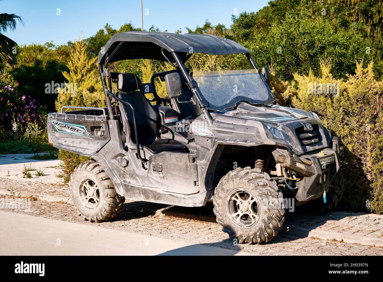 Black off road atv vehicle parked on the pavement Stock Photo Alamy