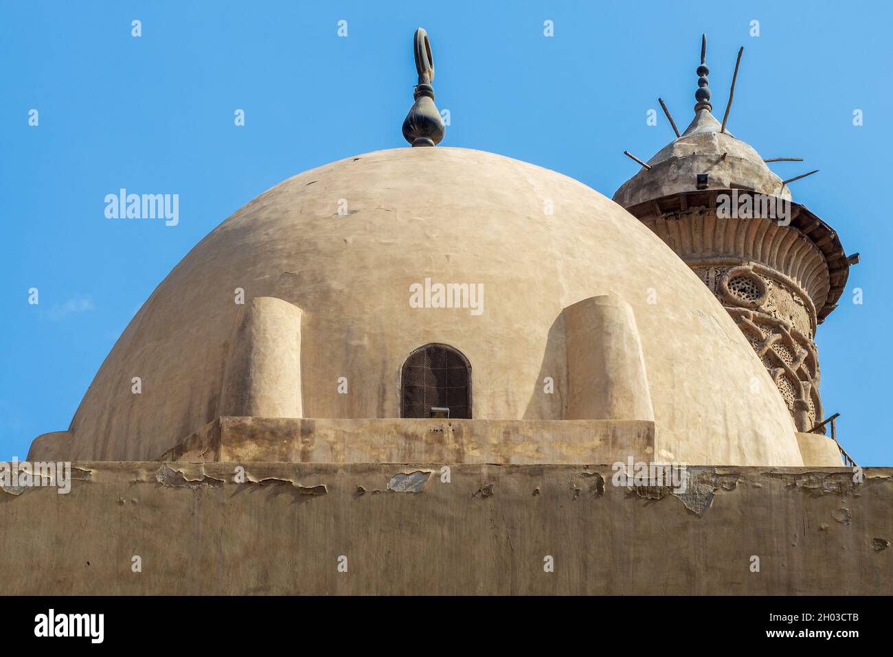 Dome at public historic mosque of Sultan Al Nassir Qalawun revealing minaret of Mamluk era El Zaher Barquq Mosque, Moez Street, Cairo, Egypt Stock Photo