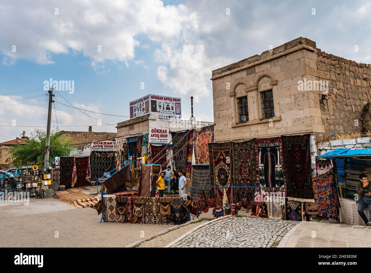 Derinkuyu Underground City Breathtaking Picturesque View of Souvenir Shops Selling Carpet on a Blue Sky Day in Summer Stock Photo