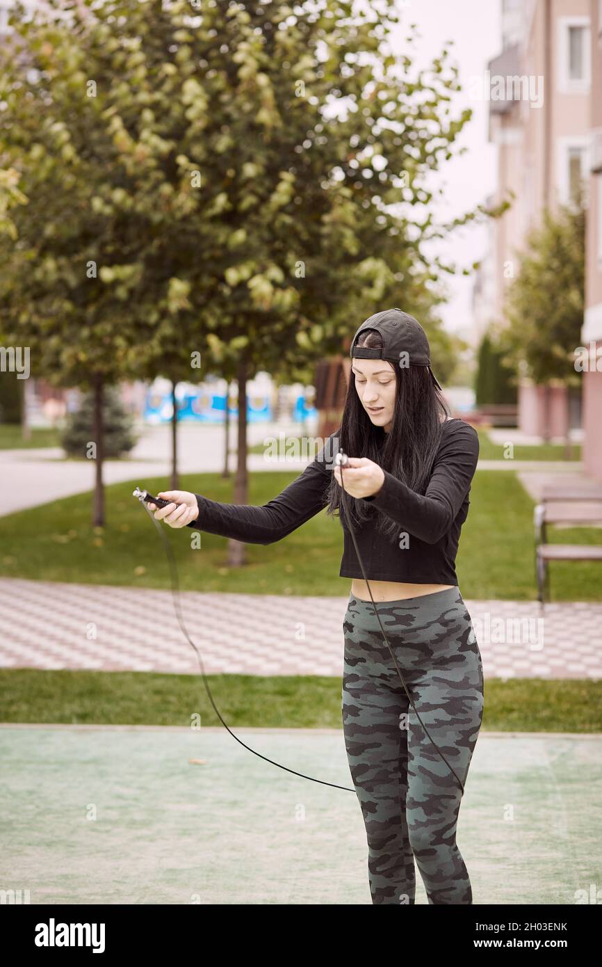 Lady Jump Rope Sportswoman doing squat exercises hi-res stock photography and images ...