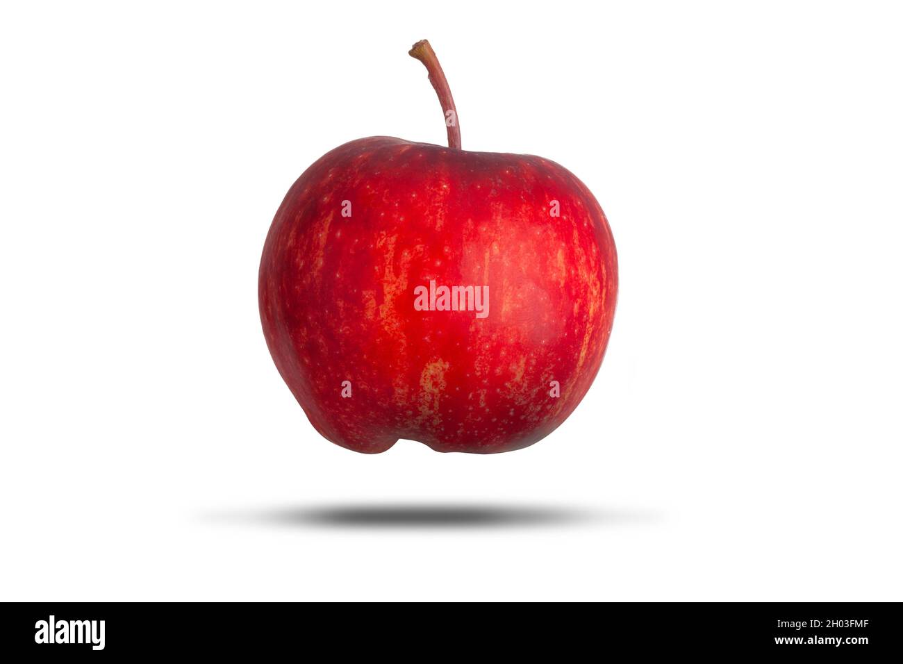Delicious fresh red whole apple with stalk floating and isolated on a white background. Healthy diet and food symbol Stock Photo