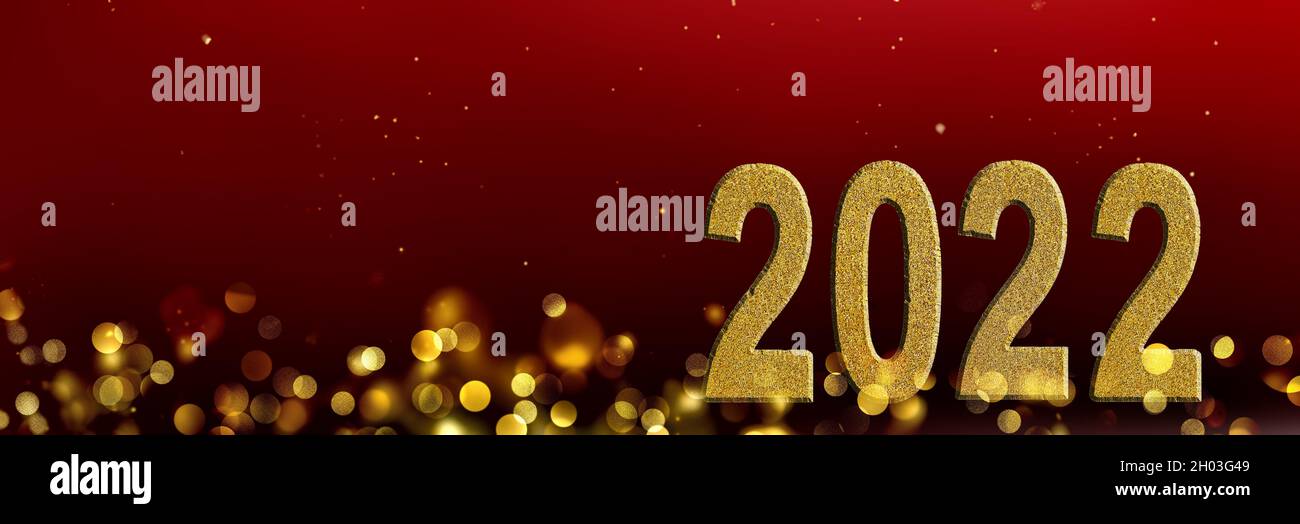golden 2022 number in blur lights and red background on panoramic view Stock Photo