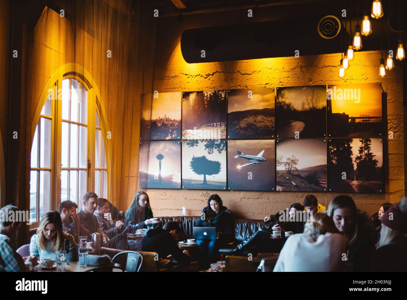 Seattle, United States of America - Customers enjoying their coffee time at Storyville Coffee Pike Place. Stock Photo