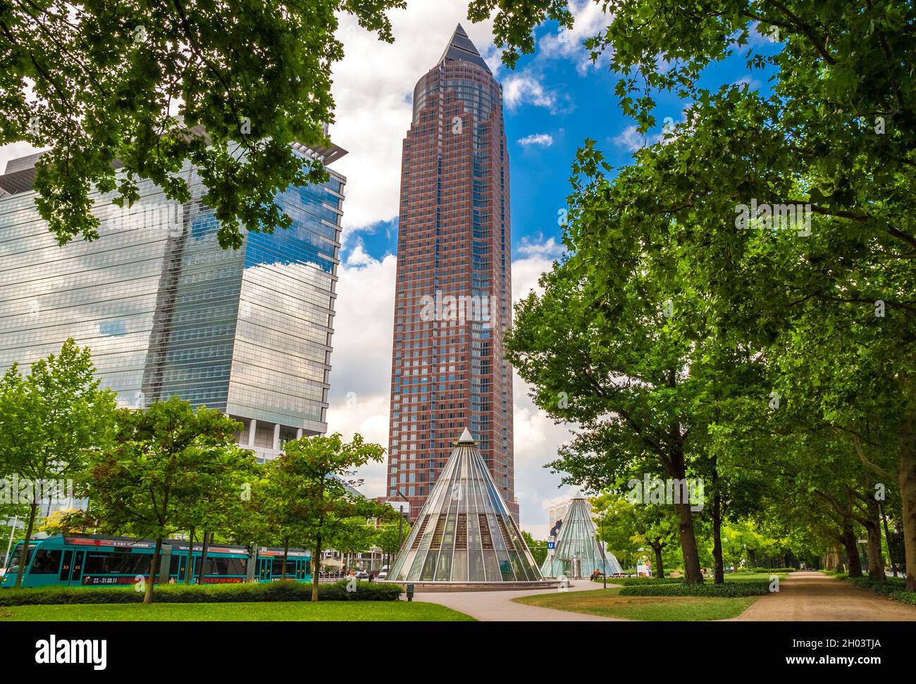 Lovely view of the famous Messeturm, or Trade Fair Tower, a skyscraper in the Westend-Süd district of Frankfurt, Germany seen from the park Ludwig... Stock Photo