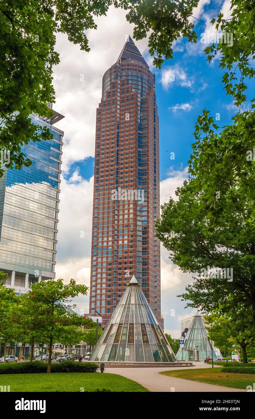 Picturesque view of the famous Messeturm, or Trade Fair Tower, a skyscraper in the Westend-Süd district of Frankfurt, Germany seen from the park... Stock Photo