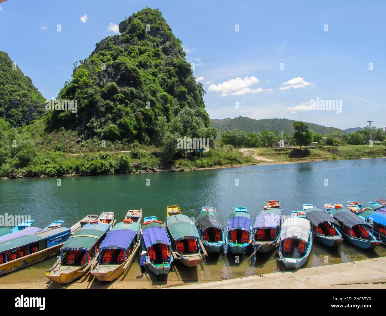 Quang Binh, Vietnam - Jul 18, 2016: a row of boats is waiting for passengers in Phong Nha Ke Bang national park site in Quang Binh Province, Vietnam Stock Photo