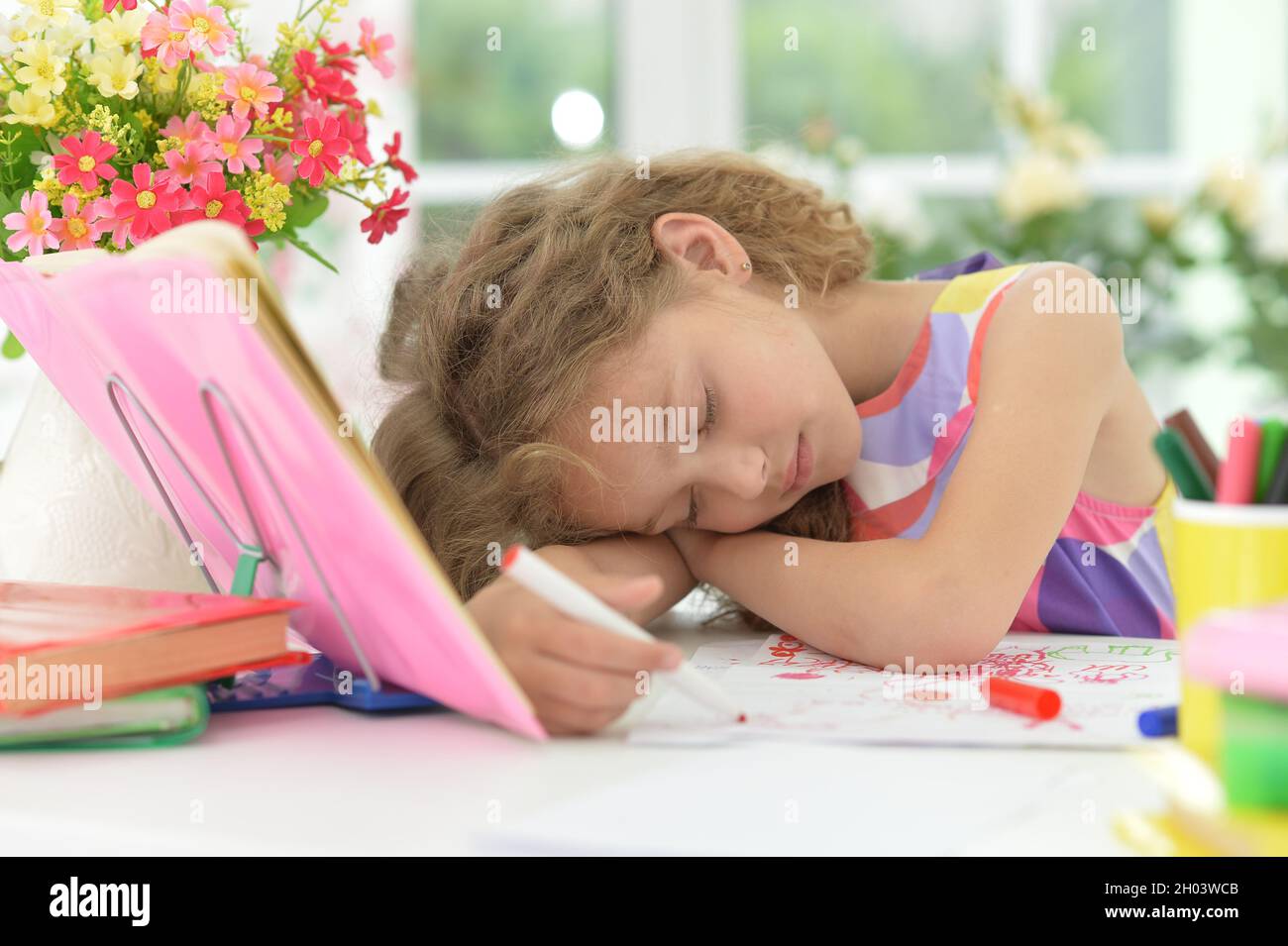 Child asleep at desk hi-res stock photography and images - Alamy