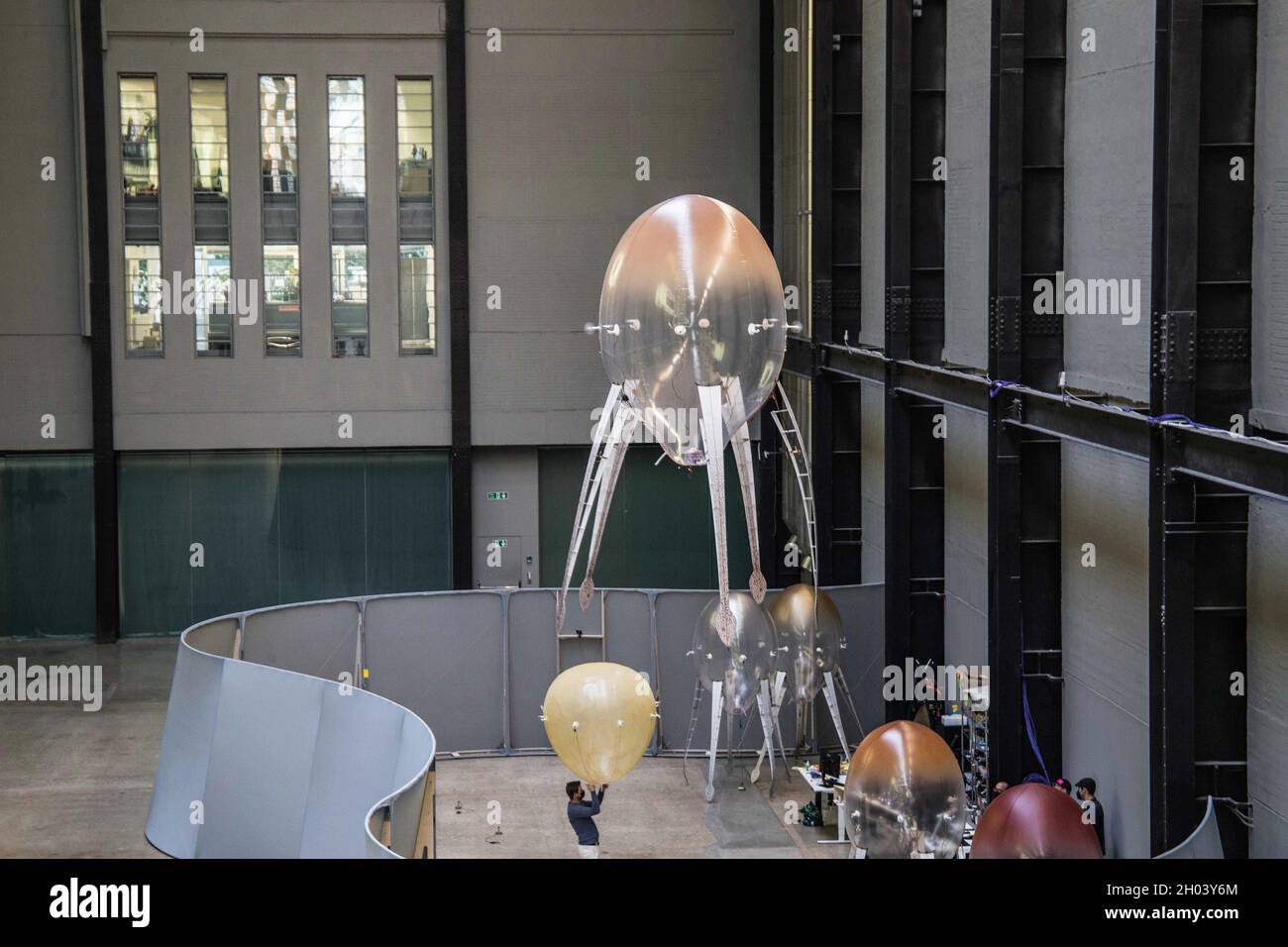 London 11 October 2021 Tate Modern  unveiled a new mayor art work by artist Anicka Yi. Yi transformed the turbine hall in a  to a her vision. Of a new ecosystem. The turbine hall is populated by Aerlbes, machines who float trough the air and react to heat.Paul Quezada-Neiman/Alamy Live News Stock Photo