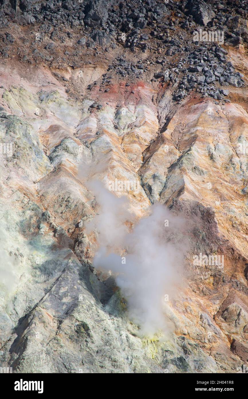 Steam rises from a vent inside a volcano crater Stock Photo