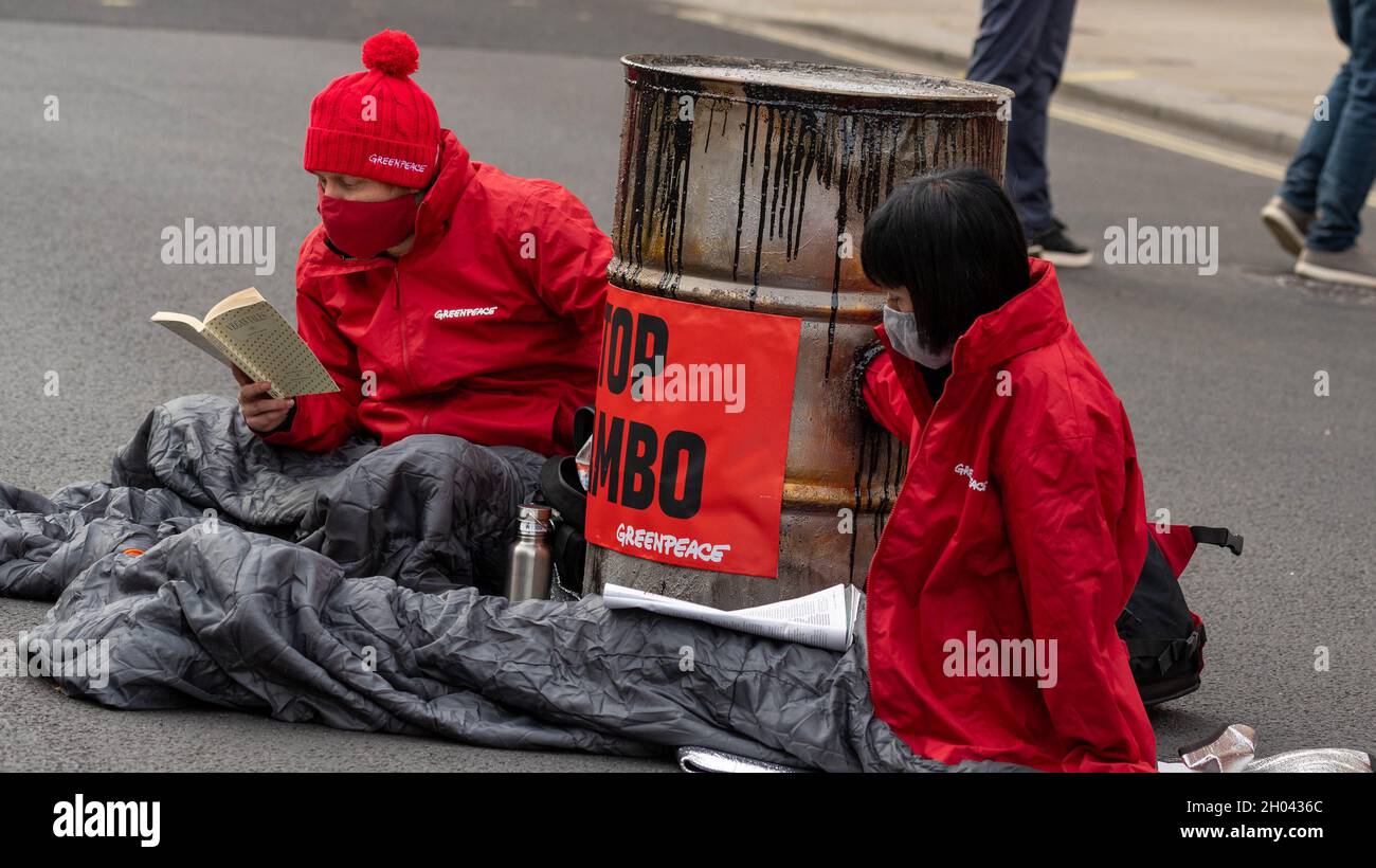 London, UK. 11th Oct, 2021. Greenpeace activists protesting about Cambo oil block Whitehall outside Downing Street London Credit: Ian Davidson/Alamy Live News Stock Photo