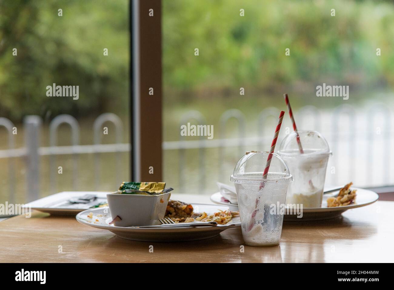 The remains of a meal on a restaurant table. Stock Photo