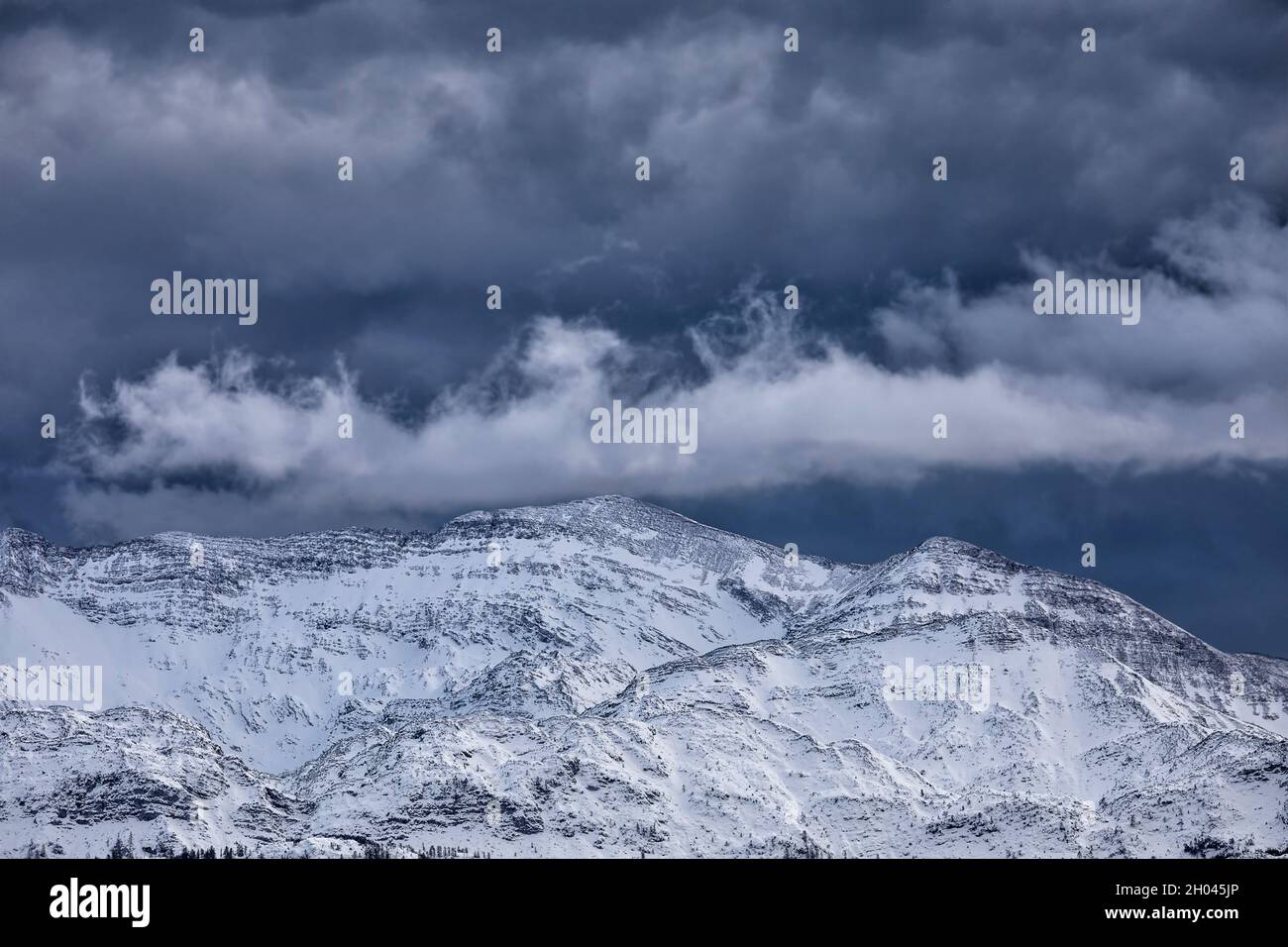 stormy sky over snowy mountain, Slovenia Stock Photo