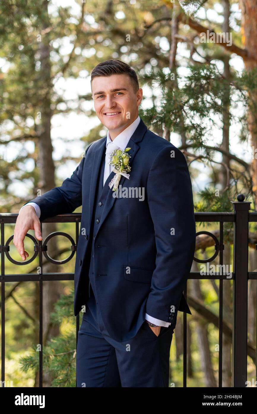 Handsome young groom wearing elegant 