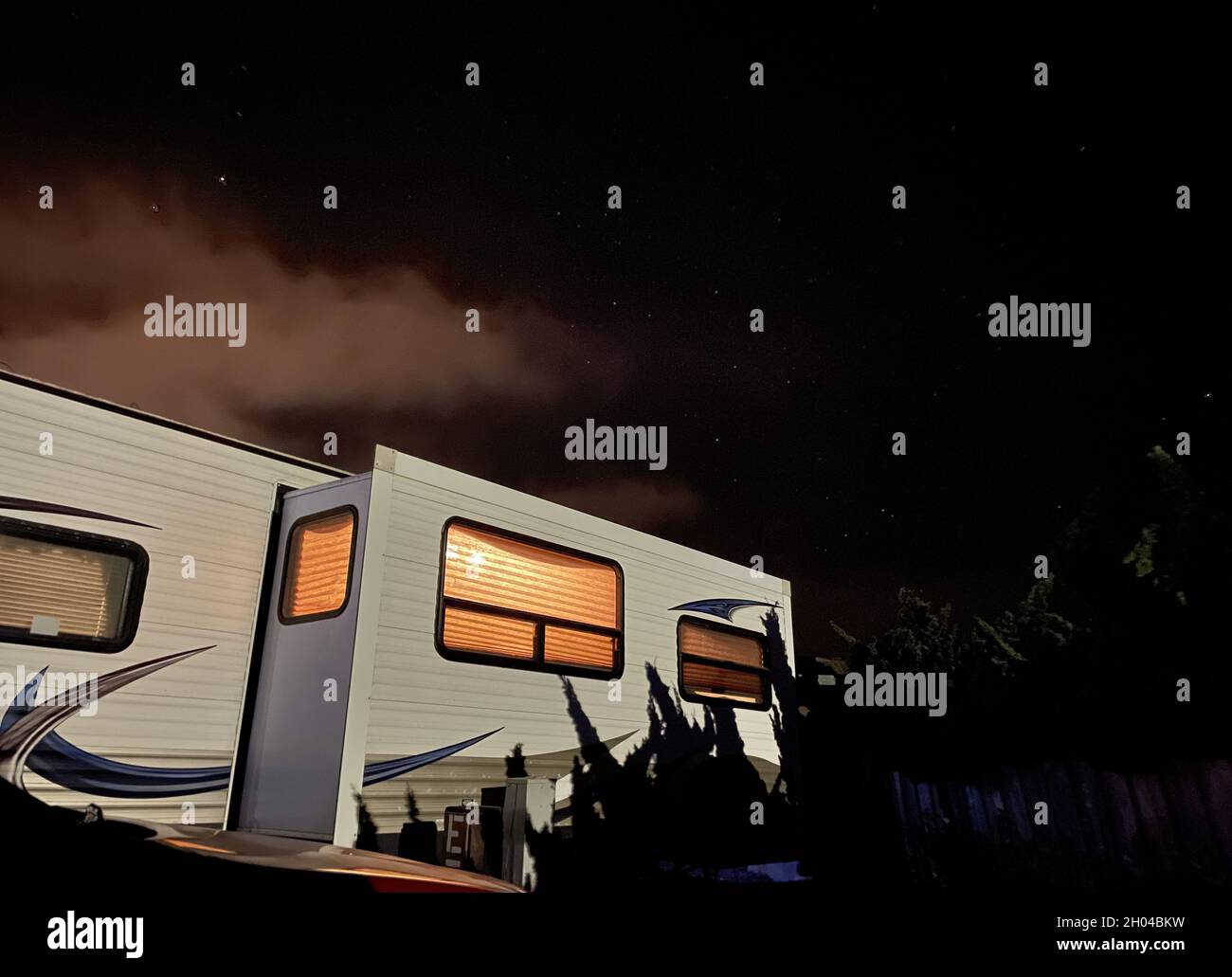 Camper parked at the beach under the starry night sky Stock Photo - Alamy