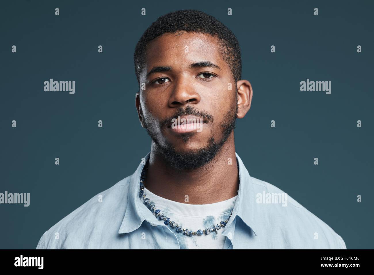 Minimal head and shoulders portrait of handsome African-American man ...