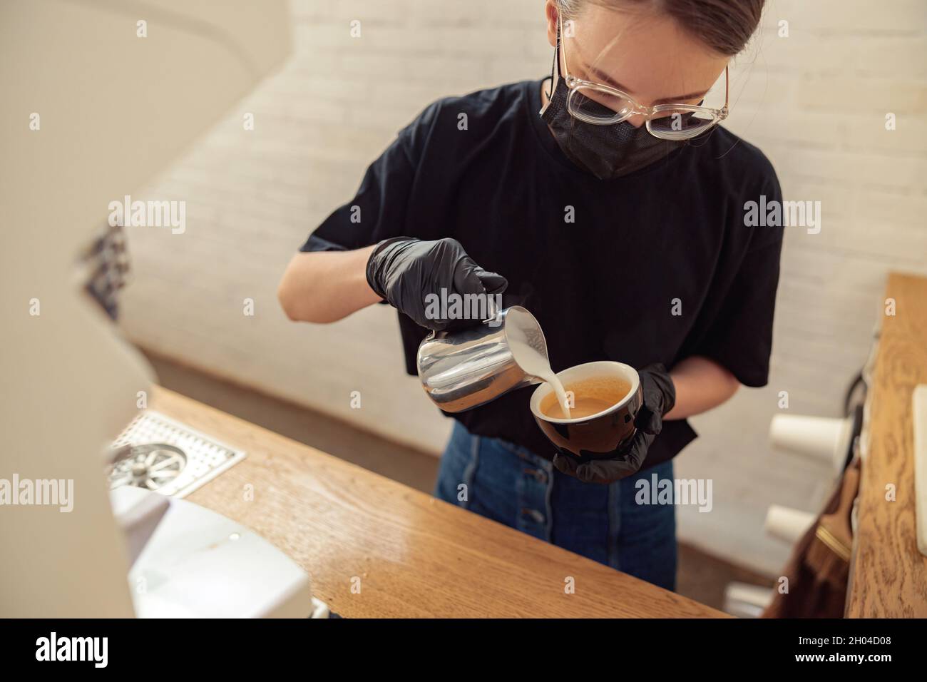 Female person working in cafeteria in covid-19 Stock Photo
