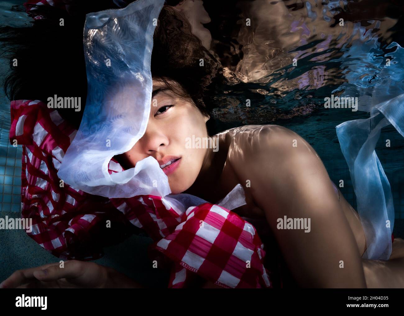 Beautiful Girl Posing Underwater Stock Photo
